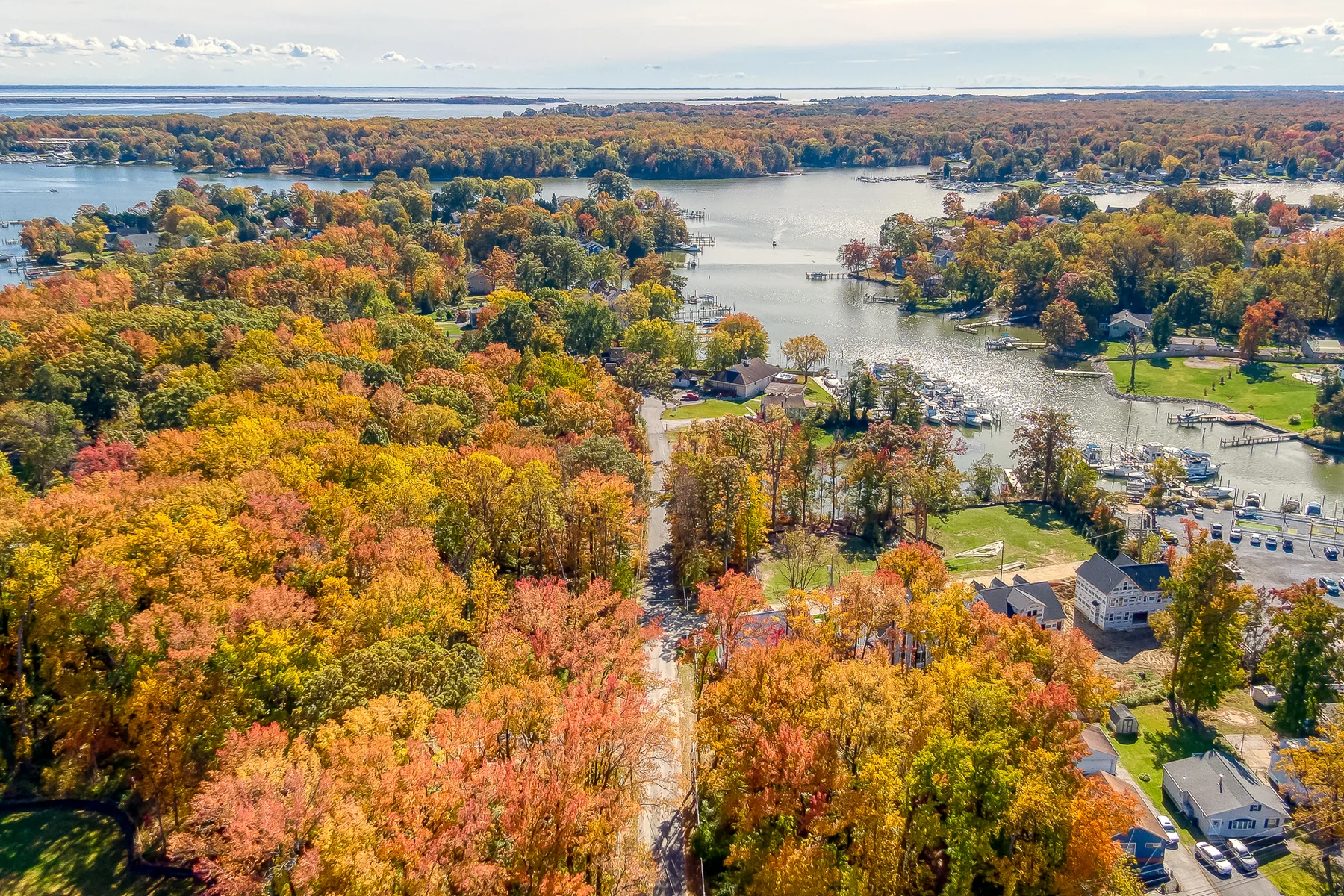Aerial view of Sue Creek in Essex, Maryland, with marinas, boat docks and the Chesapeake Bay beyond